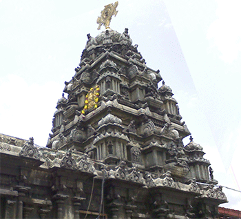 The central sanctum sanctorum of Bhadrachalam, with the Sudarshana Chakra at the top and the miniature of the temple's deity. - courtesy- wiki commons-Prashanth.286